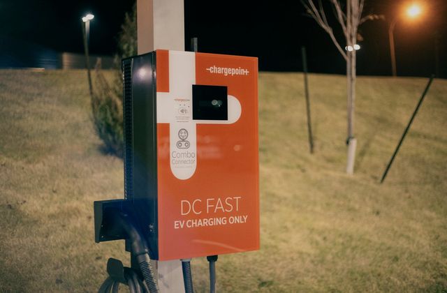An EV fast charger at night